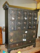 An oriental style cabinet with 22 small drawers and 2 doors, COLLECT ONLY.