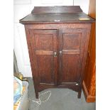 An oak two door cabinet, COLLECT ONLY.