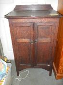 An oak two door cabinet, COLLECT ONLY.