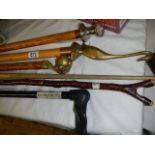 A quantity of walking sticks, some with brass handles COLLECT ONLY.