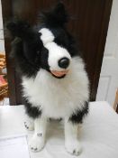 A toy Border Collie dog.
