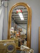 An arched top mirror with coloured decoration, COLLECT ONLY.