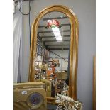 An arched top mirror with coloured decoration, COLLECT ONLY.