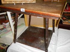 An oak square table on turned supports. COLLECT ONLY.