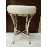 A mid to late 20th-century chrome stool with white seat. COLLECT ONLY.