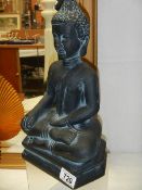 A figure of a Buddha,