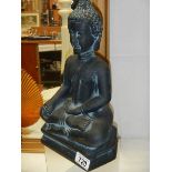 A figure of a Buddha,