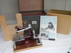 A cased vintage 'Essex' sewing machine.