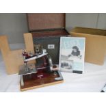 A cased vintage 'Essex' sewing machine.