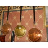 Two copper and a brass warming pan. COLLECT ONLY.