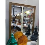 A large framed bevel edged mirror. COLLECT ONLY.