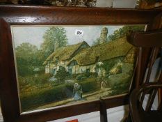 A framed and glazed print of a needlepoint of Anne Hathaway's cottage. COLLECT ONLY.