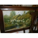 A framed and glazed print of a needlepoint of Anne Hathaway's cottage. COLLECT ONLY.