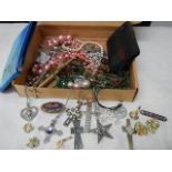 A mixed lot of costume jewellery including cross and other pendants.