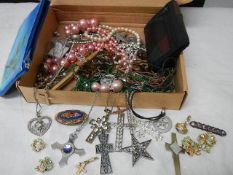 A mixed lot of costume jewellery including cross and other pendants.