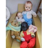 Three vintage dolls and a vintage teddy bear.