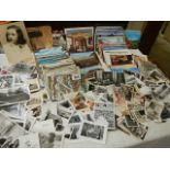 A large mixed lot of postcards and black & white photographs.