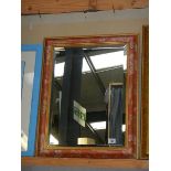 A framed bevel edged mirror. COLLECT ONLY.