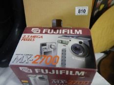 A boxed Fujifilm X2700 camera.