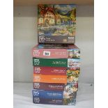 Eight jigsaw puzzles, complete in bags.