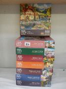 Eight jigsaw puzzles, complete in bags.