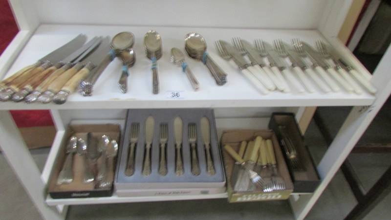 A mixed lot of cutlery including fish knives and forks.