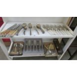 A mixed lot of cutlery including fish knives and forks.