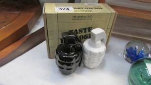 A boxed pair of Grenade salt and pepper shakers