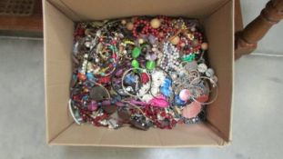 A large box of costume jewellery.
