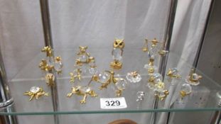 A quantity of gilt and glass animals etc.,