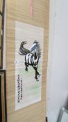 A Chinese scroll depicting a horse.