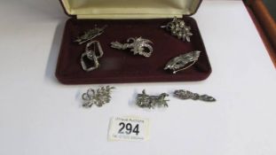 Eight marcasite brooches.