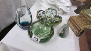 Three studio glass bowls and a paperweight.