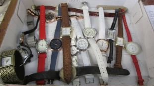 Approximately 15 assorted wrist watches.