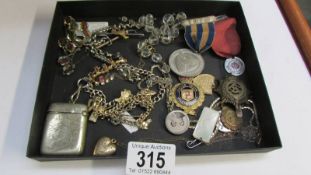 A mixed lot of medals, badges etc.,