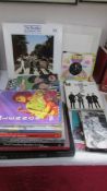 A quantity of Beatles books, singles, CD's etc.,