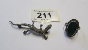 A marcasite lizard brooch in good condition and a mid 20C marcasite and green stone ring. Size Q,