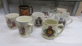 A quantity of George VI and Elizabeth II coronation mugs.