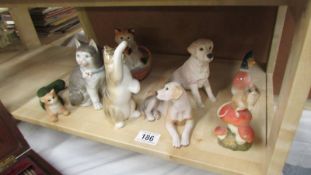 A quantity of cat and dog figures.