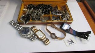 A mixed lot of costume jewellery and watches.