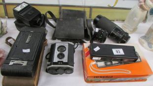 A Kodak plate camera, Miranda lens 75-300mm, Boots 110 Teleflash camera, boxed,