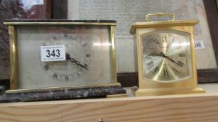 Two mantel clocks.