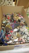 A large box of costume jewellery.