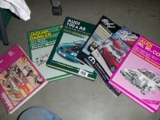 A quantity of car manuals.