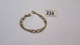 A yellow and white gold bracelet, marked 375, 18 grams.