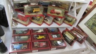 Two shelves of 35 Matchbox Models of Yesteryear die cast models.