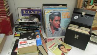 A quantity of Elvis Lp's, singles, books etc.,