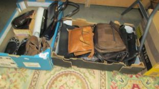 Two boxes of ladies hand bags and shoes.