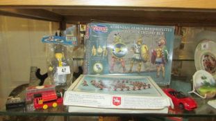A mixed lot of toy soldiers etc.,