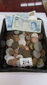 A mixed lot of coins and three bank notes.